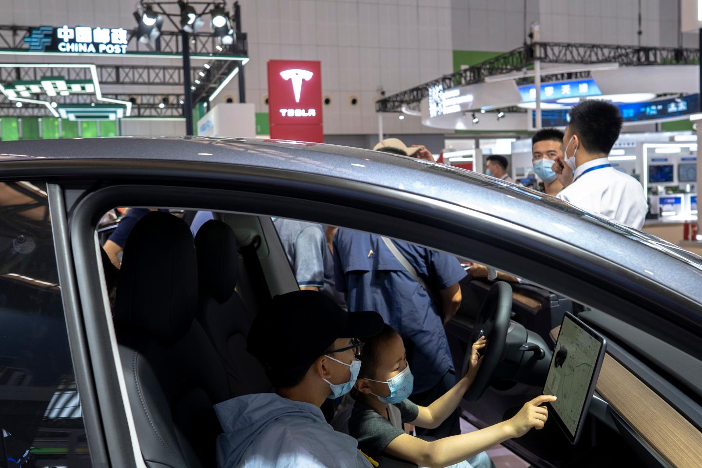 Two kids in the driver's cab, have shown great interest in
