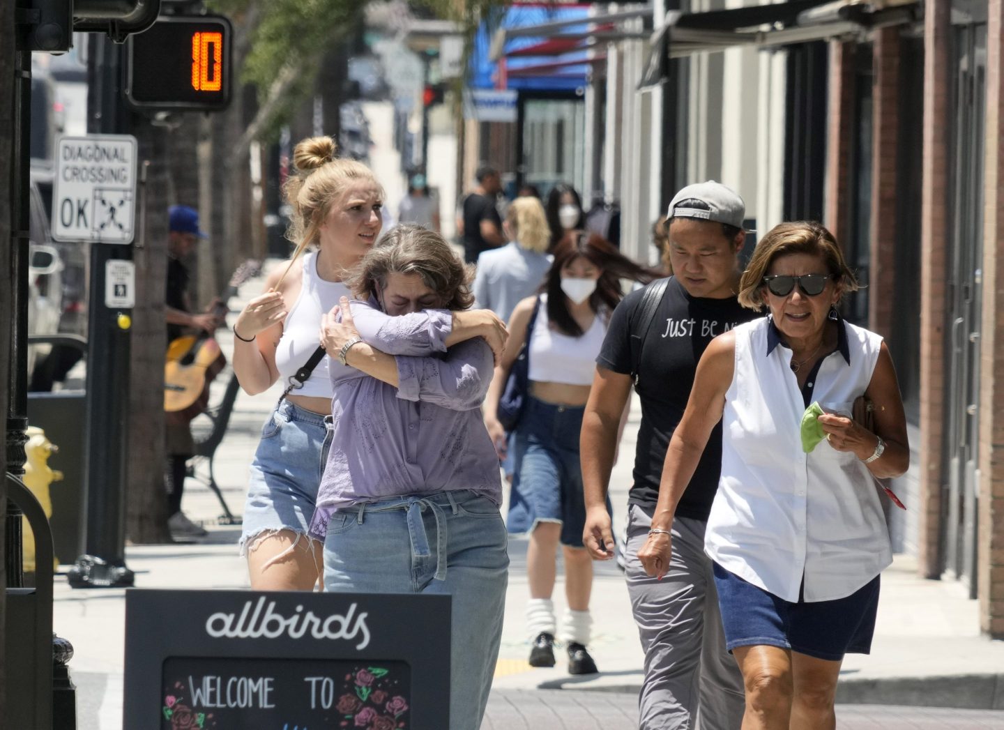 a woman sneezing during allergy season