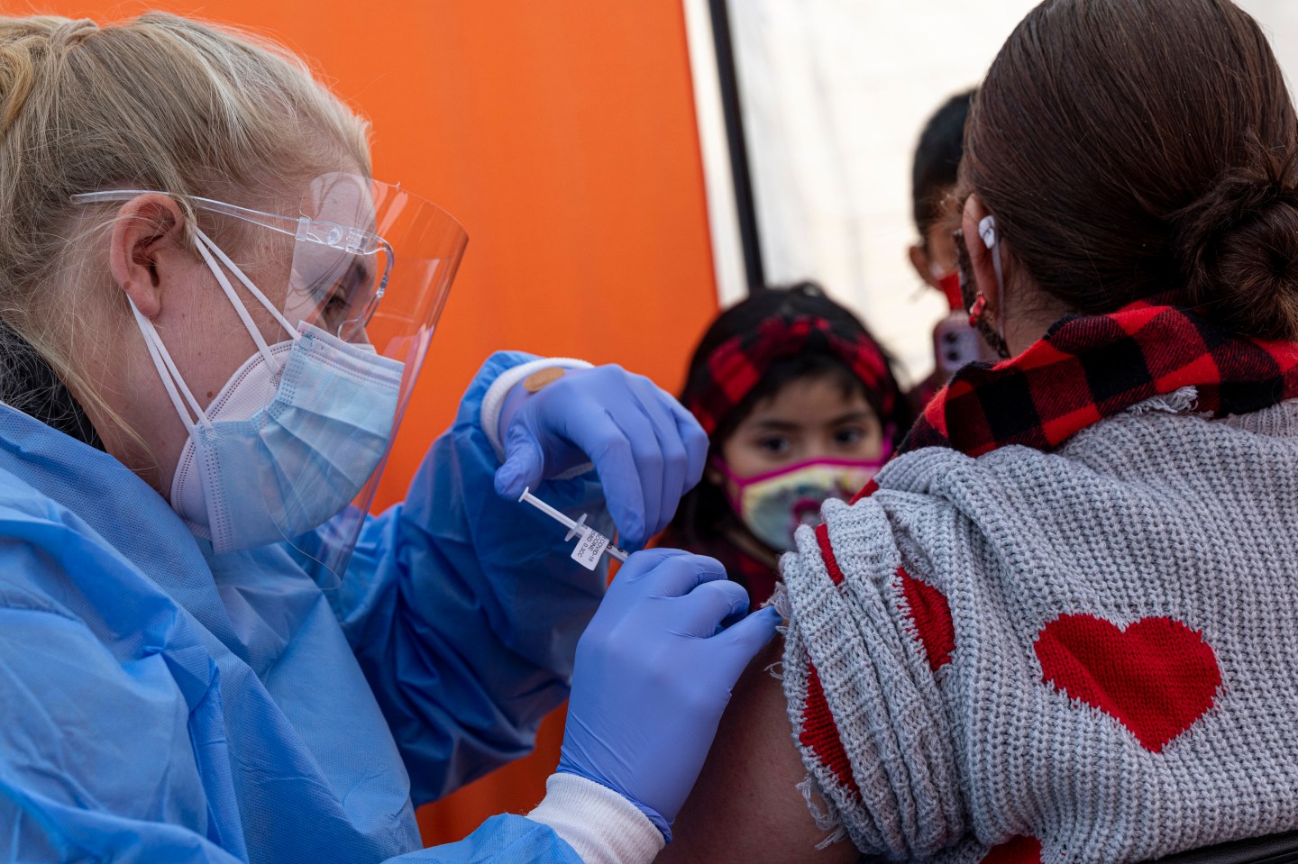 A healthcare worker administers a Pfizer-BioNTech Covid-19 vaccine at vaccination site in San Francisco, California, U.S.