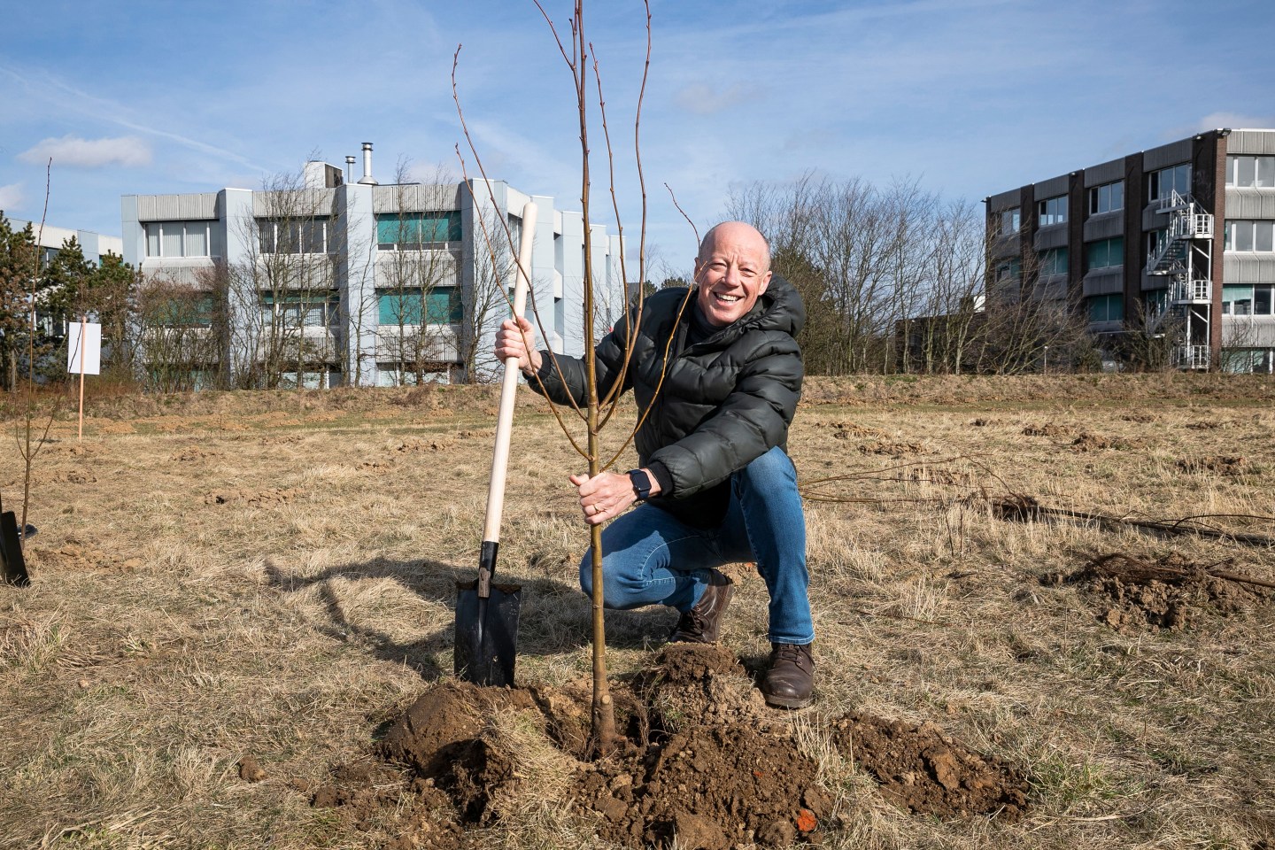 Piet Vandendriessche, CEO of Deloitte Belgium, plants a tree along with other Deloitte volunteers in Zaventem, March 2022.