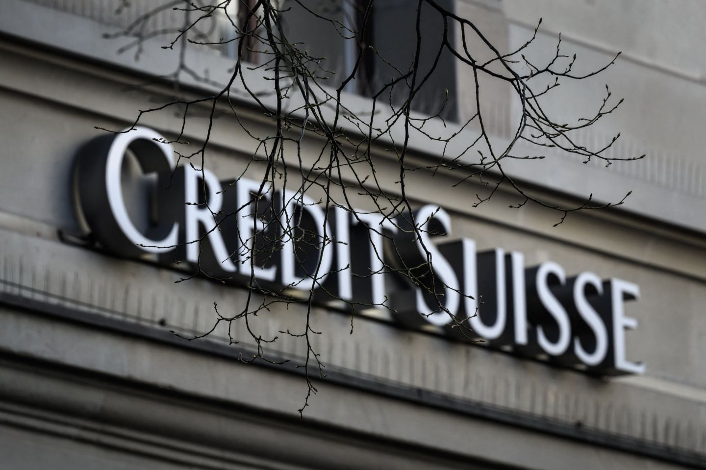 This illustration photo shows a sign with the logo of Switzerland's second largest bank "Credit Suisse" at their headquarters in Zurich on March 23.