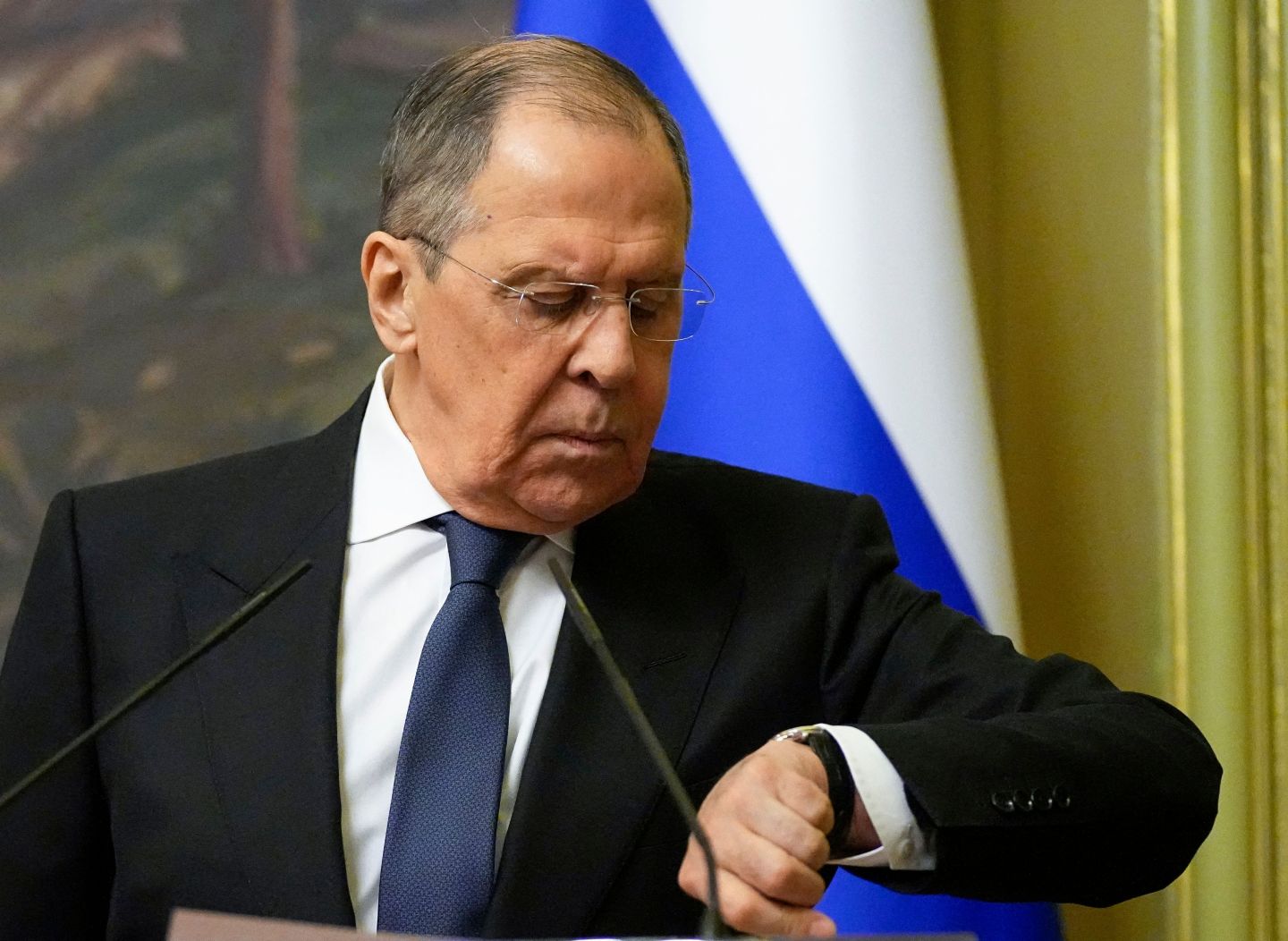 Russian Foreign Minister Sergei Lavrov looks at his watch during a joint news conference following talks with his Armenian counterpart in Moscow, on April 8, 2022.