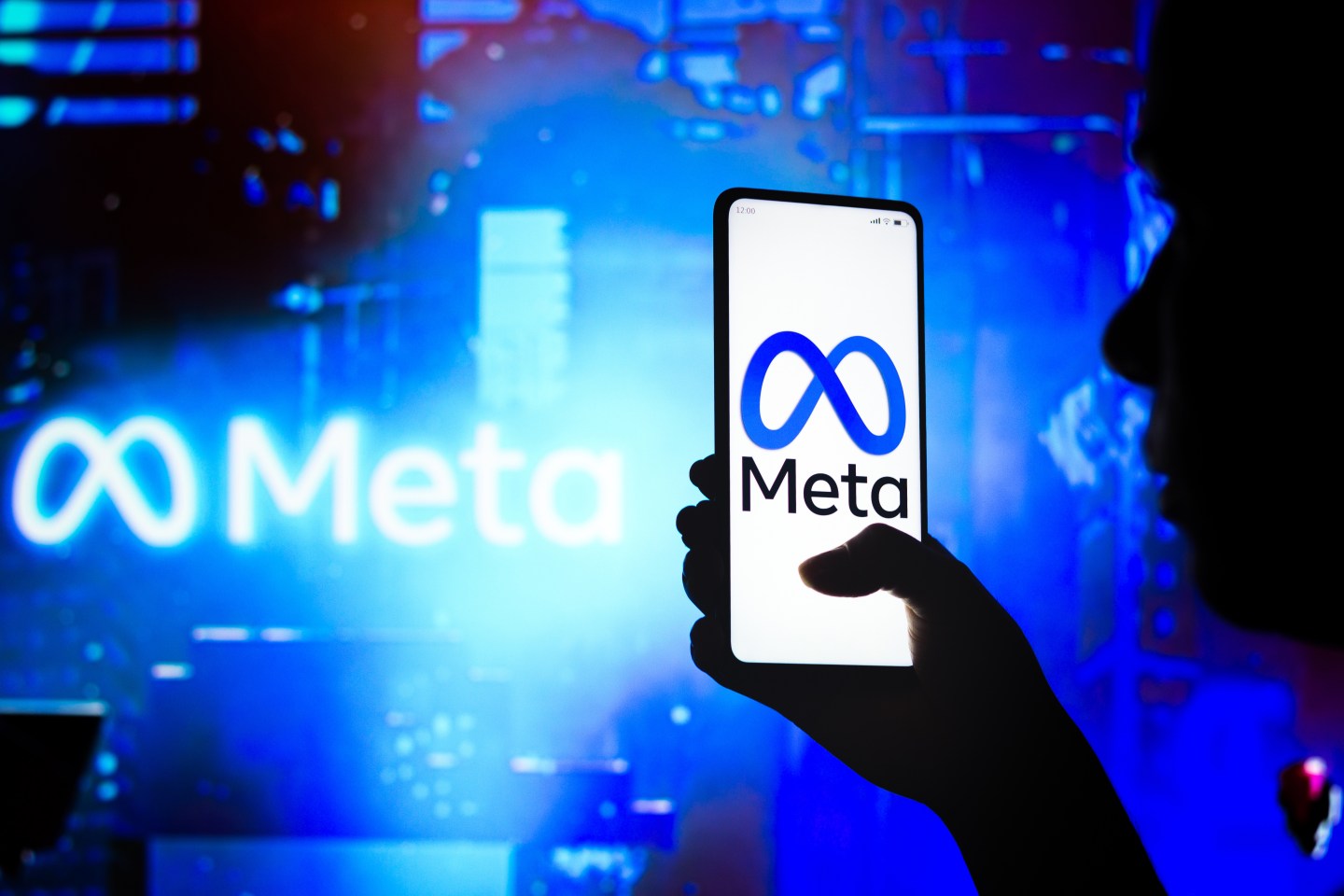 Photo illustration of the Meta app on a phone.
