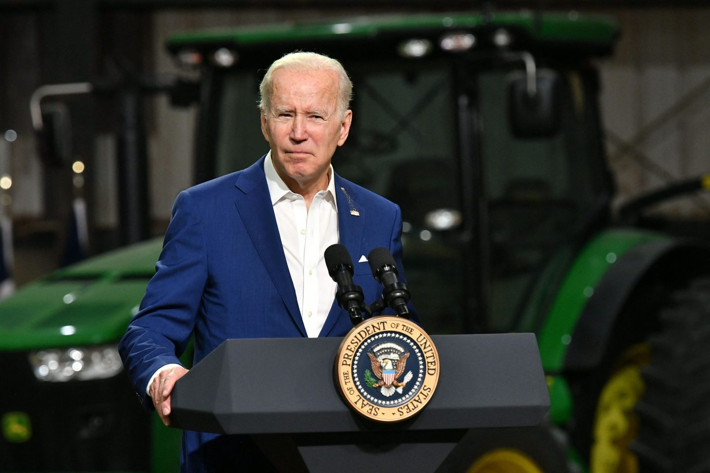 U.S. President Joe Biden stands behind a lectern in Iowa