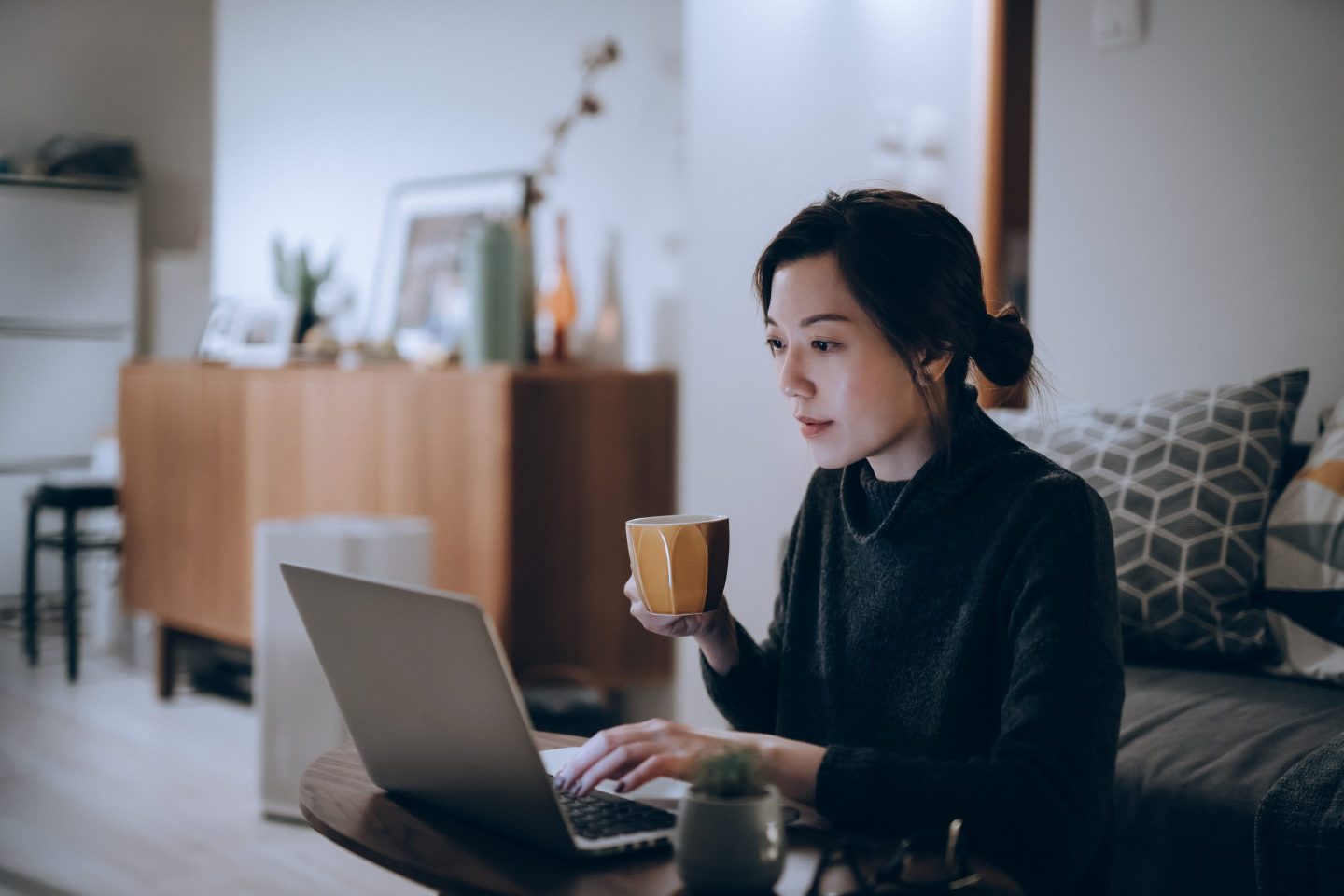 woman at work drinking coffee