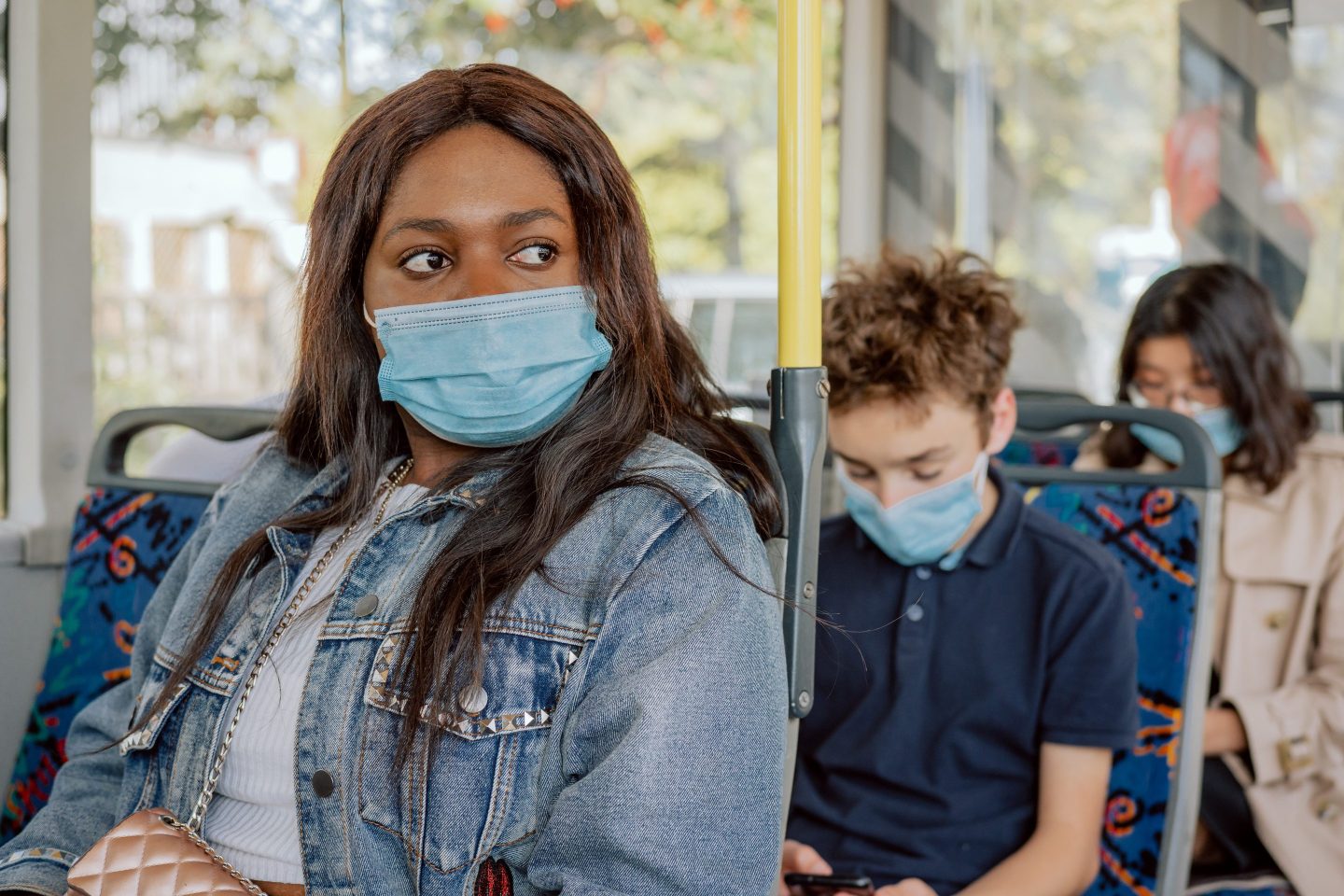 Woman sitting on bus commuting to work