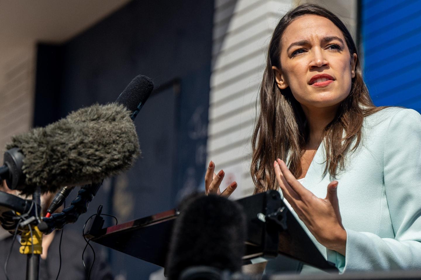 Rep. Alexandria Ocasio-Cortez speaks at podium