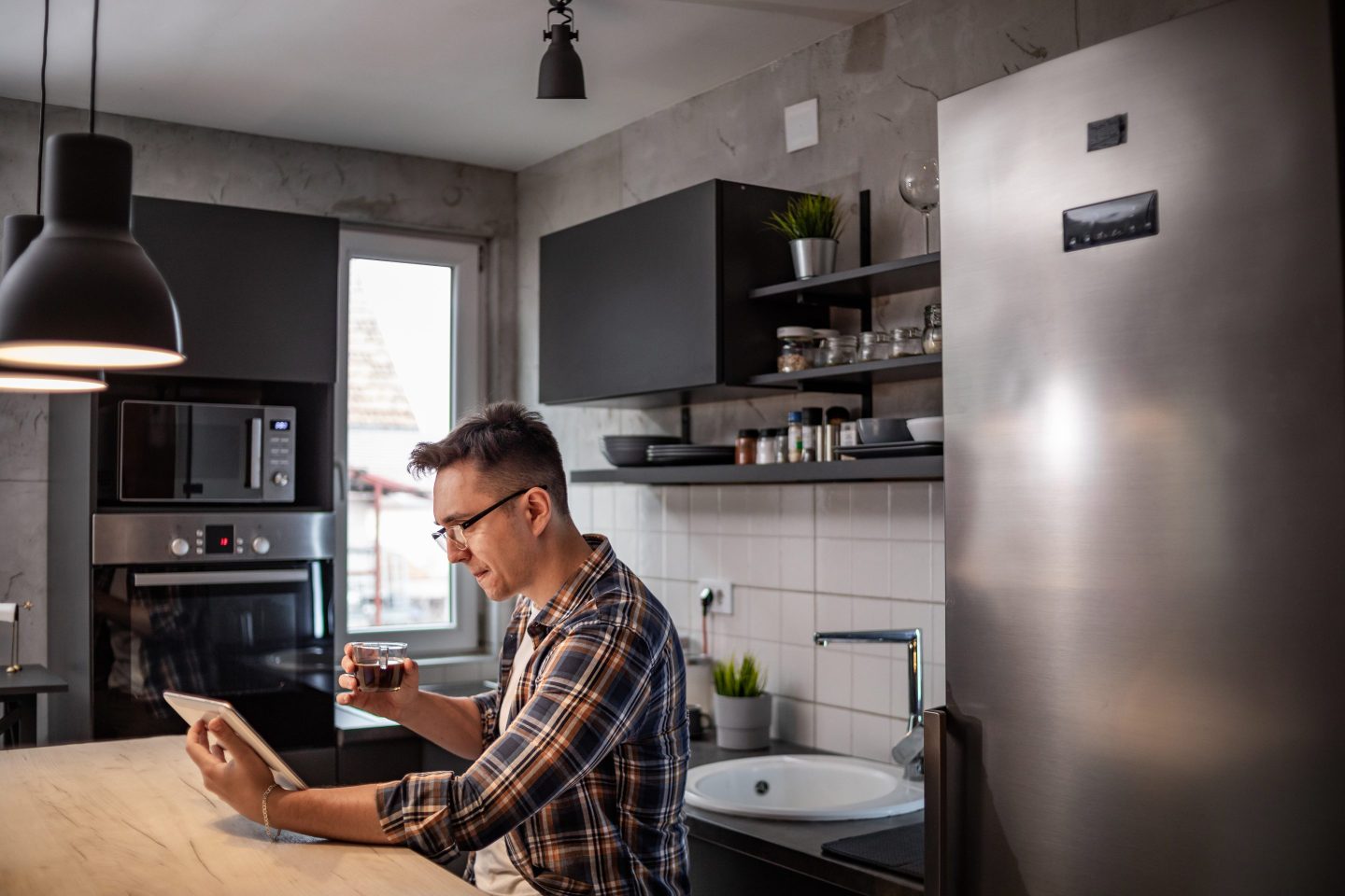 Man working remotely in kitchen
