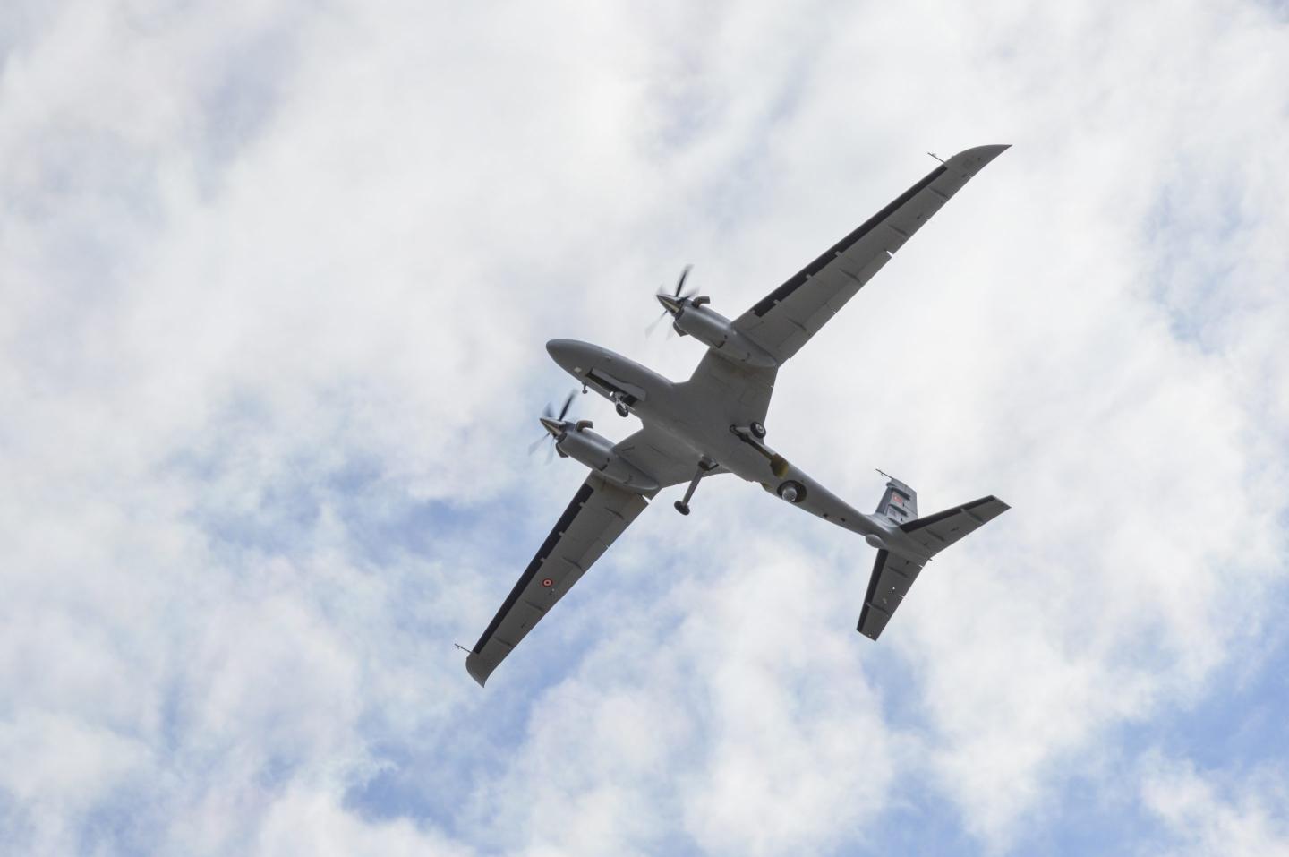 A Turkish Bayraktar drone seen flying from below