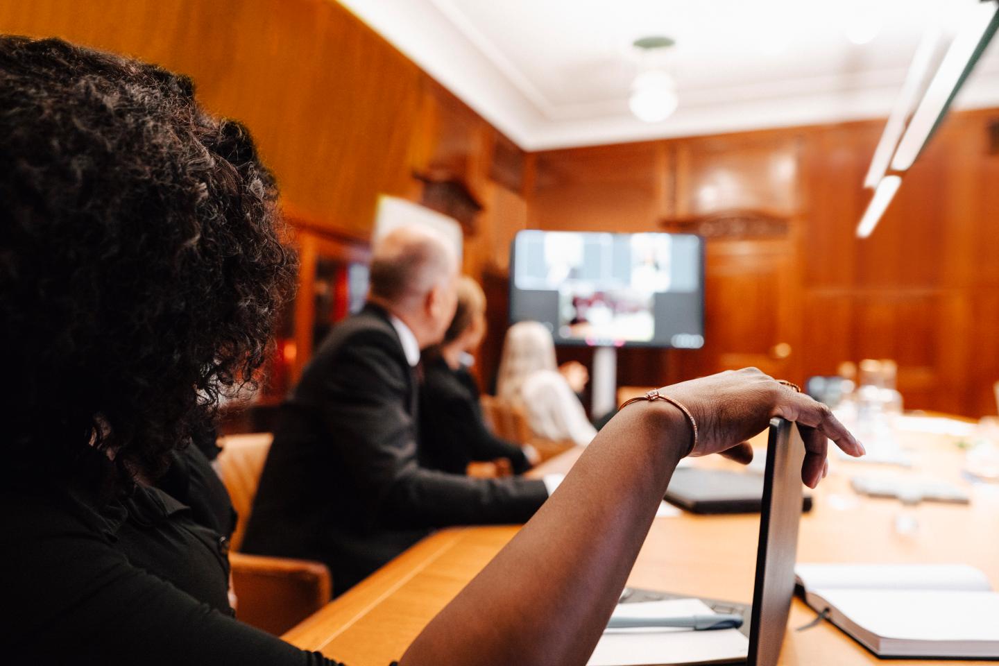 women watching remote participant during a video call