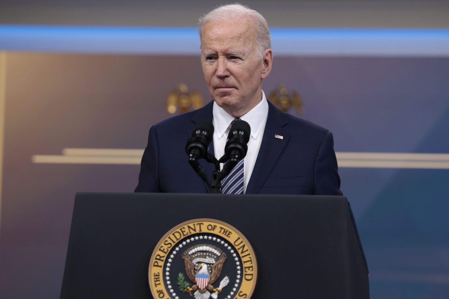 President Joe Biden speaks at a podium