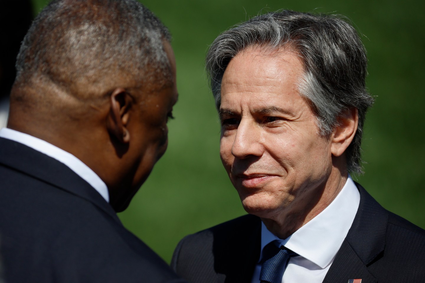 Defense Secretary Lloyd Austin (L) and Secretary of State Antony Blinken visit ahead of a celebration of Judge Ketanji Brown Jackson's confirmation to the Supreme Court on the South Lawn of the White House on April 08, 2022 in Washington, DC.