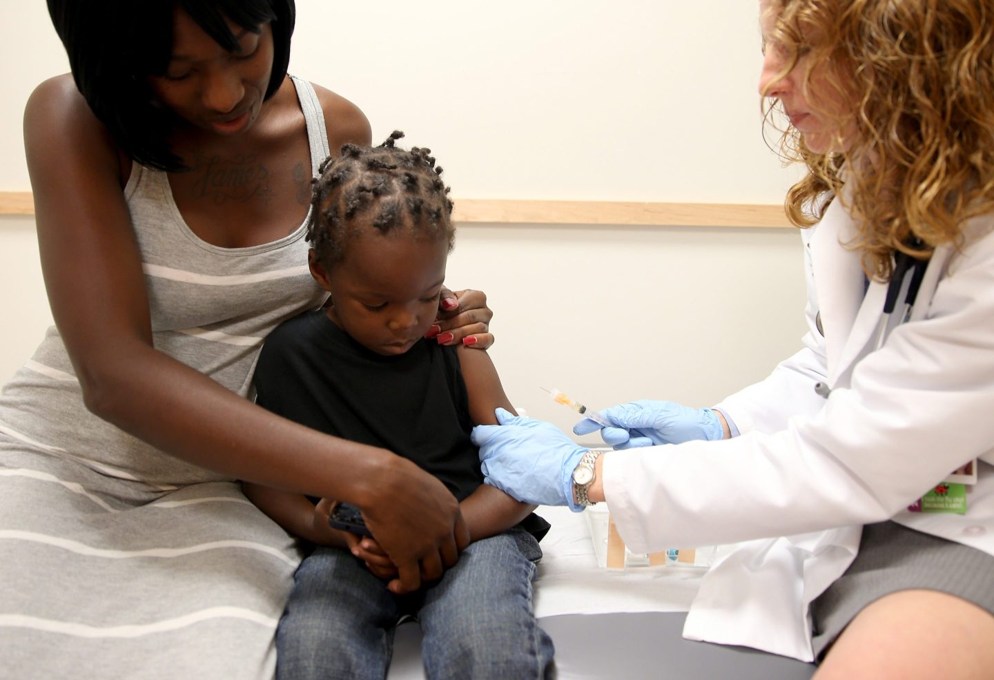 Young boy gets vaccinated against the measles