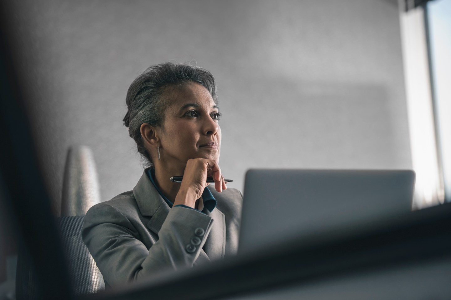 Businesswoman using laptop in office