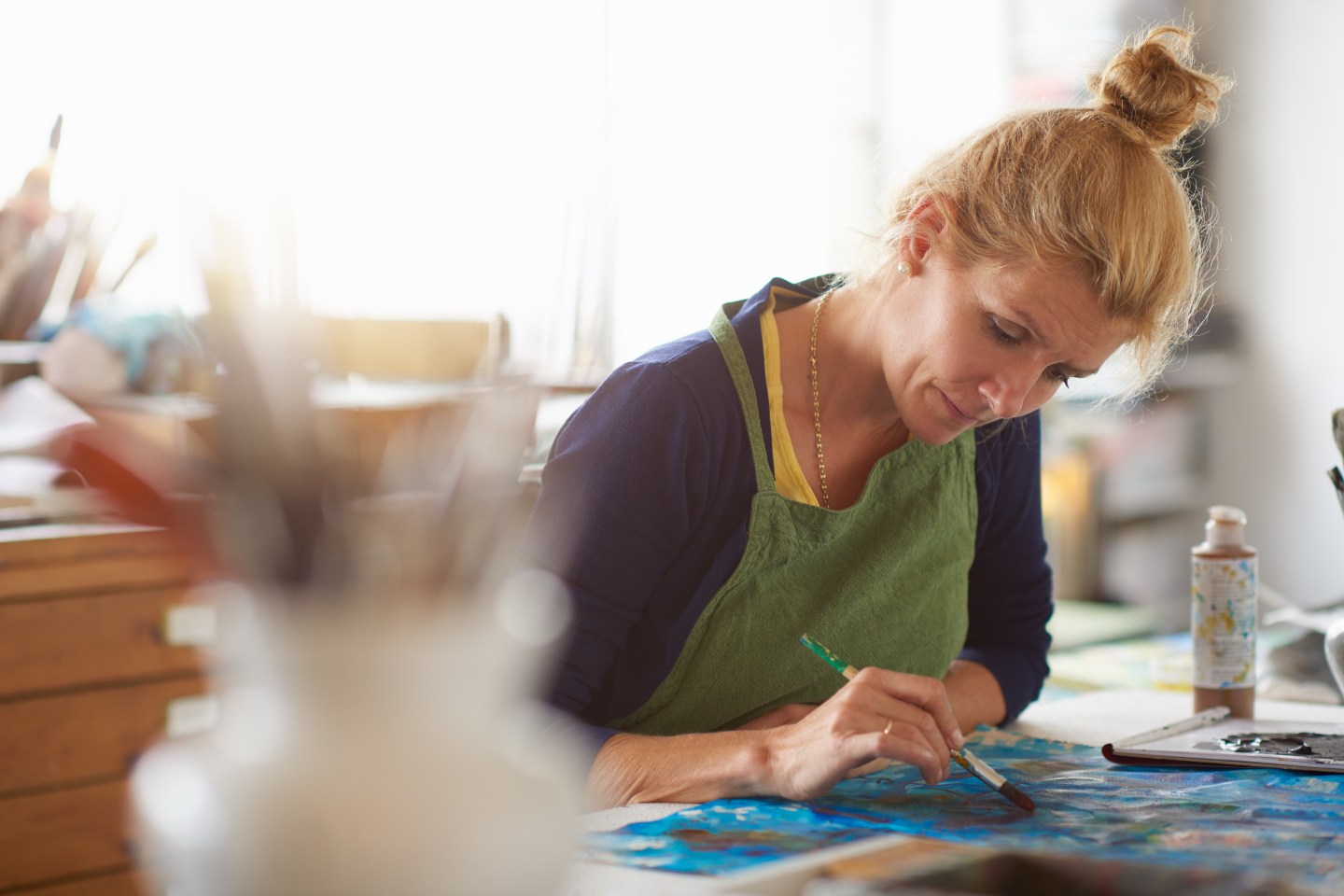 Craftswoman at art table