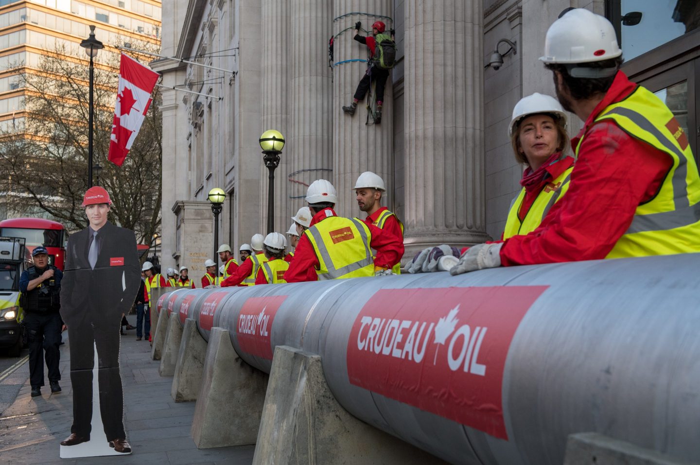 Photo of Greenpeace activists protesting against Canadian Prime Minister Justin Trudeau's plans to build an oil pipeline in British Columbia outside of the Canadian High Commission in London, England, on April 18, 2018.