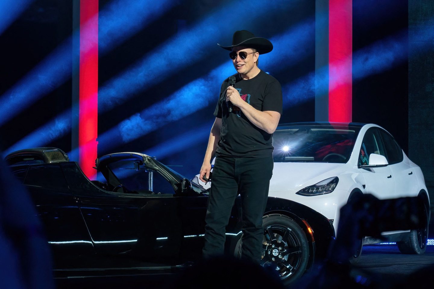 Elon Musk talks on stage at the Tesla Giga Texas event.