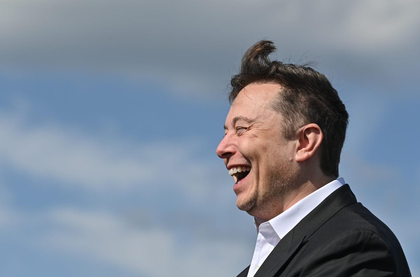Elon Musk laughing.