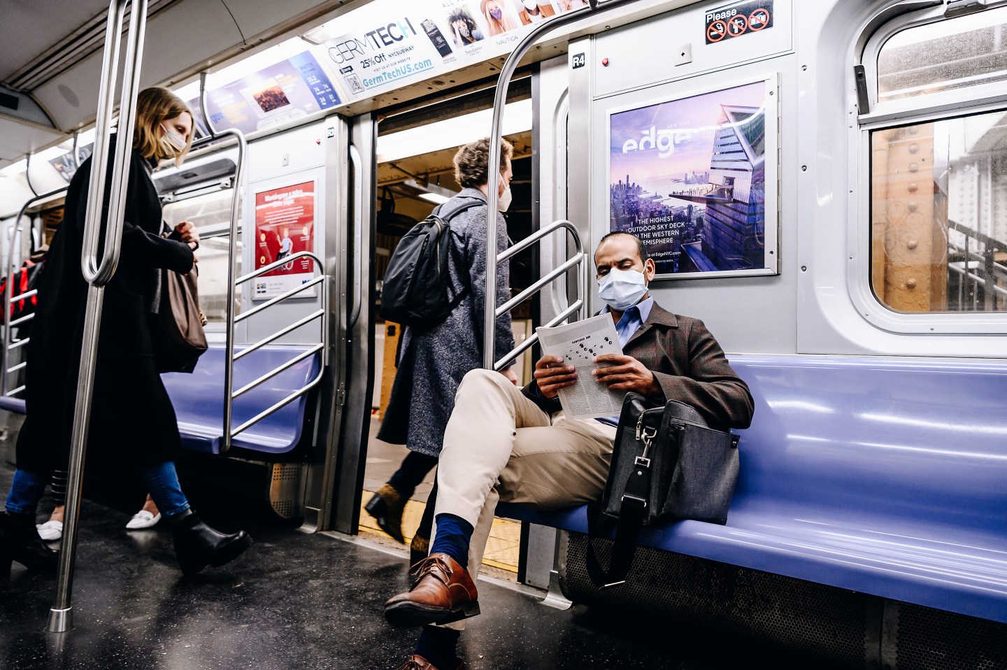 A passenger wearing a protective mask on the subway train in New York City.