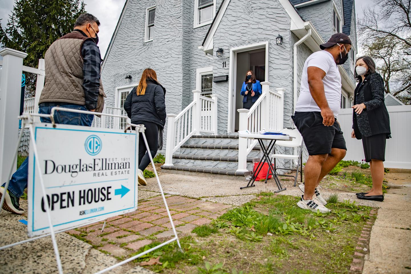 Real Estate agents work at an open house in New York.