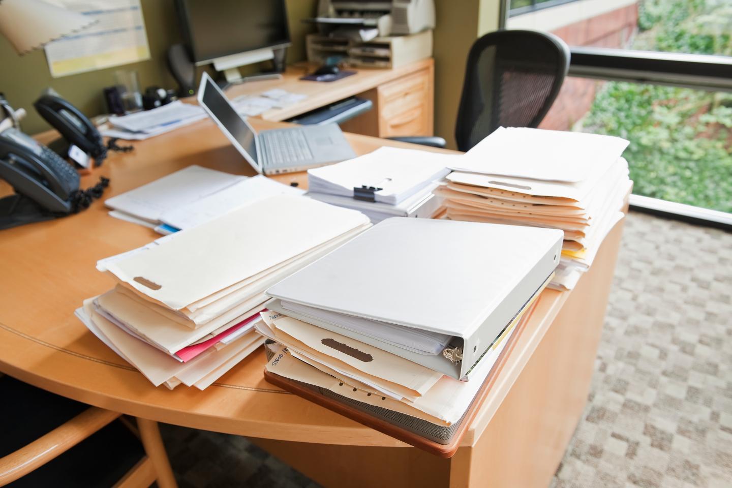 Stacks of Folders on Desk