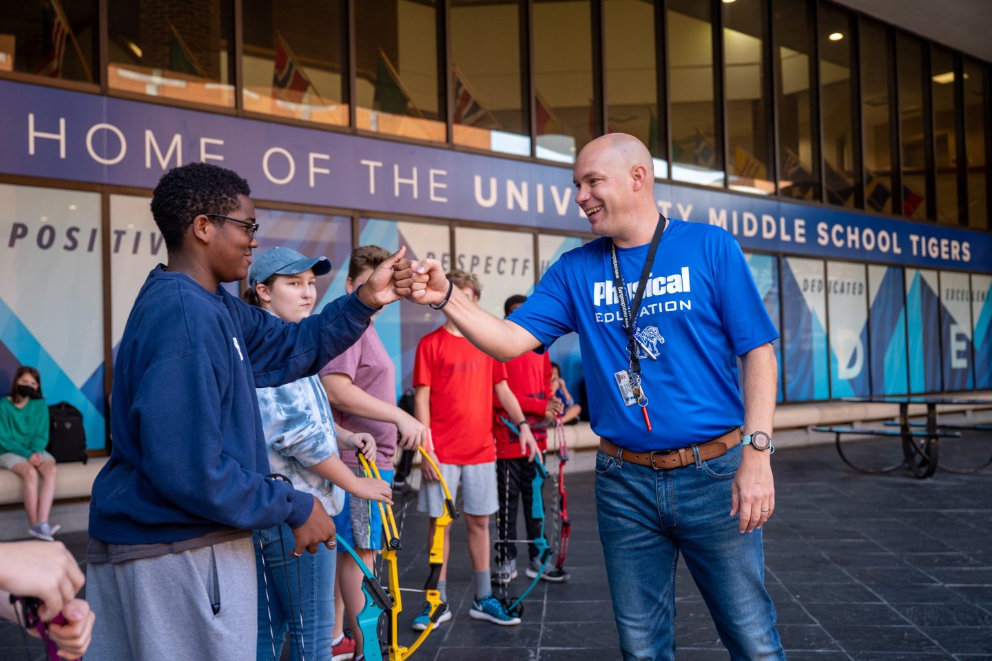 University Middle physical education teacher Keith Loupe interacts with students.