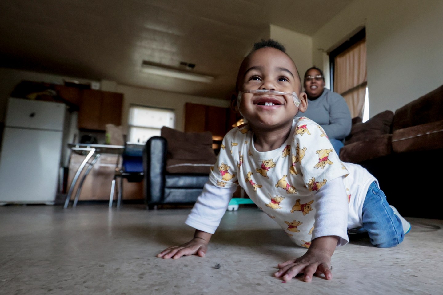 Curtis Means crawls around as his mother, Michelle Butler, keeps an eye on him at their home in Eutaw, Ala., on Wednesday, March 23. Growing numbers of extremely premature infants, like Curtis, are getting life-saving treatment and surviving.