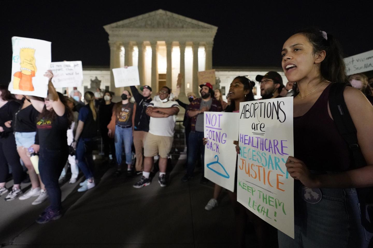 People gathering in response to Supreme Court opinion to overturn Roe v Wade