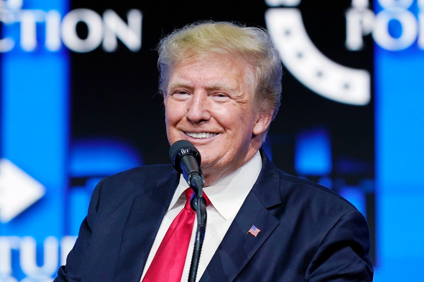 Former President Donald Trump smiles as he pauses while speaking to supporters at a Turning Point Action gathering in Phoenix, July 24, 2021. A criminal case brought by special counsel John Durham, the prosecutor appointed to investigate potential government wrongdoing in the early days of the Trump-Russia probe, heads to trial in Washington's federal court on May 16. The case centers on a single false statement that Michael Sussmann, a cybersecurity lawyer who represented the Hillary Clinton presidential campaign in 2016, is alleged to have made to the FBI during a meeting that year.