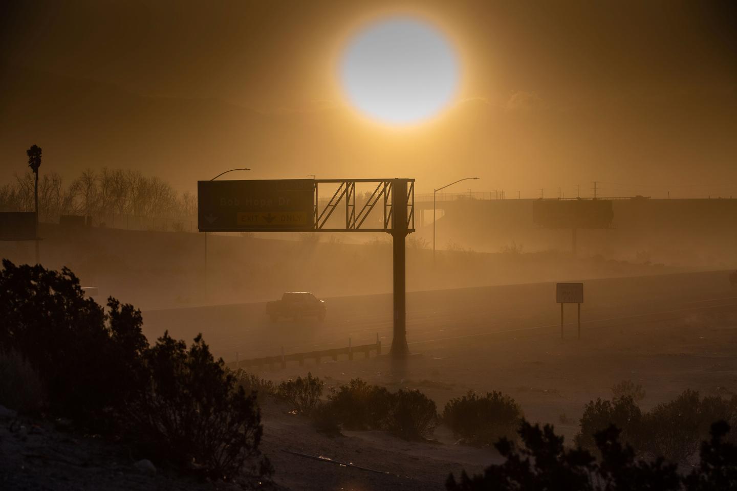 High winds and blowing sand drop the visibility to near zero during a fierce storm in California's southern desert.