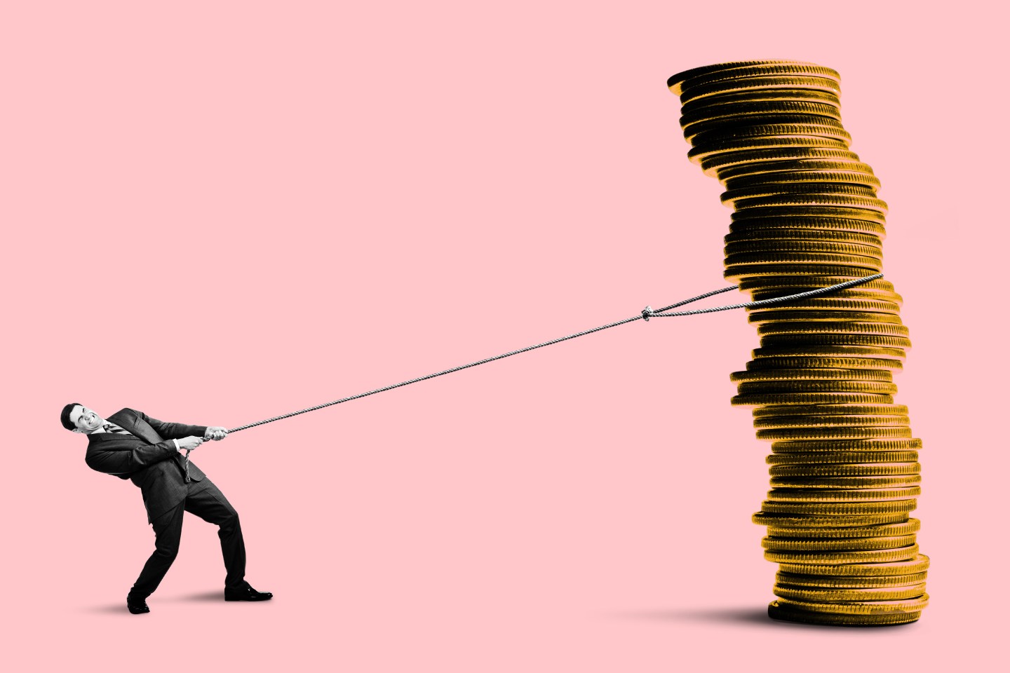 Man pulling a large stack of coins