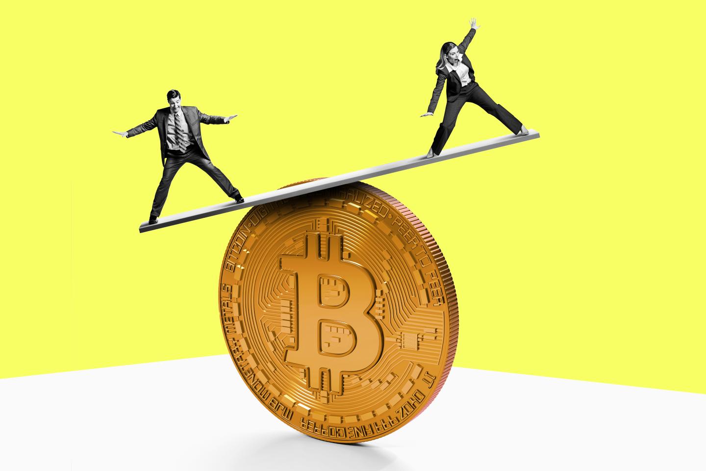 people balancing on a bitcoin token