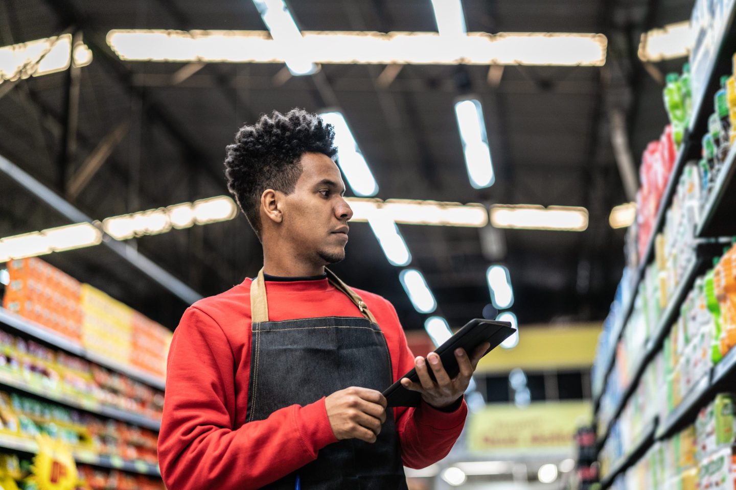 young, Black man working at a supermarket