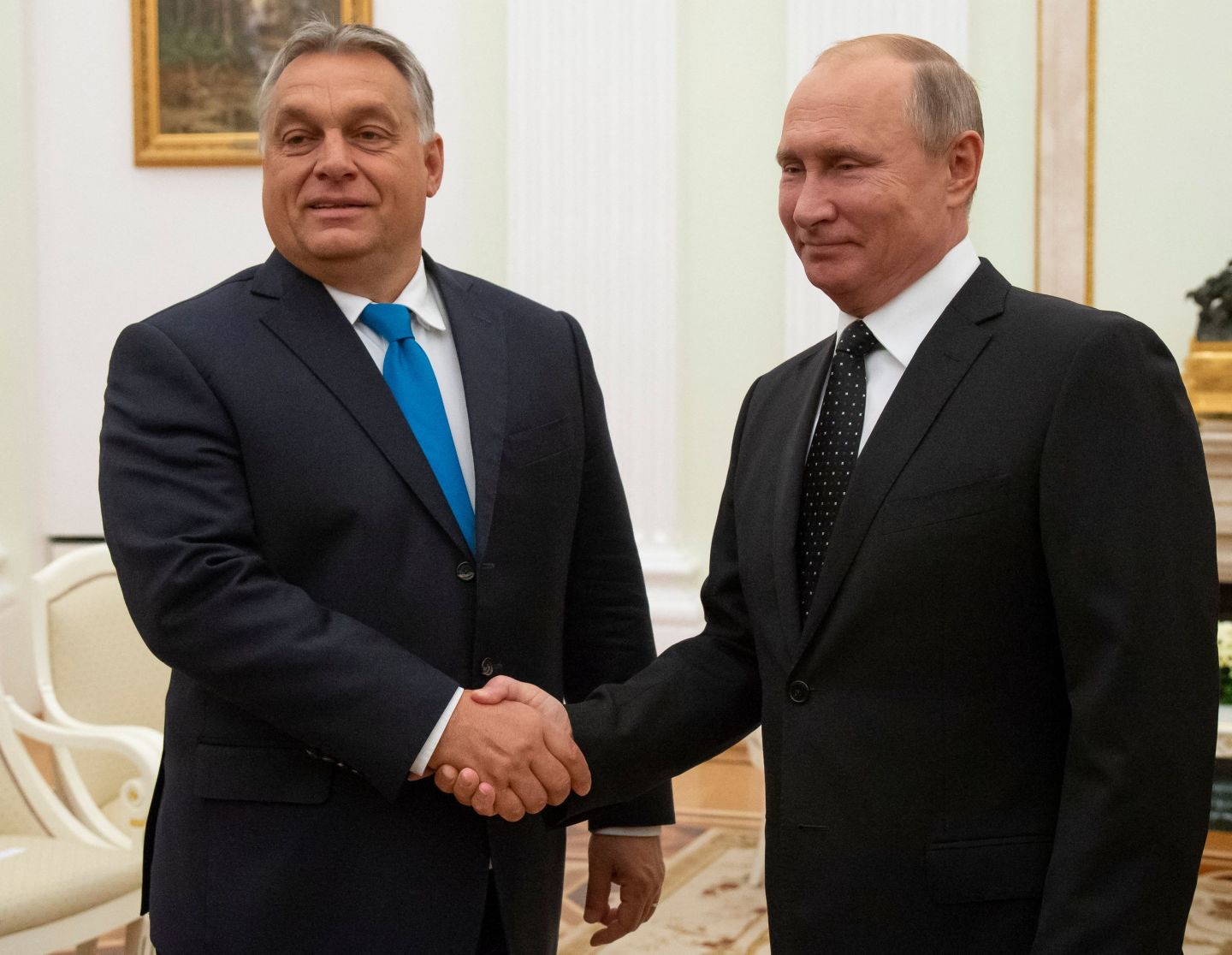 Hungarian Prime Minister Viktor Orban (L) shakes hands with Russian President Vladimir Putin during their meeting in the Kremlin in Moscow, on September 18, 2018.