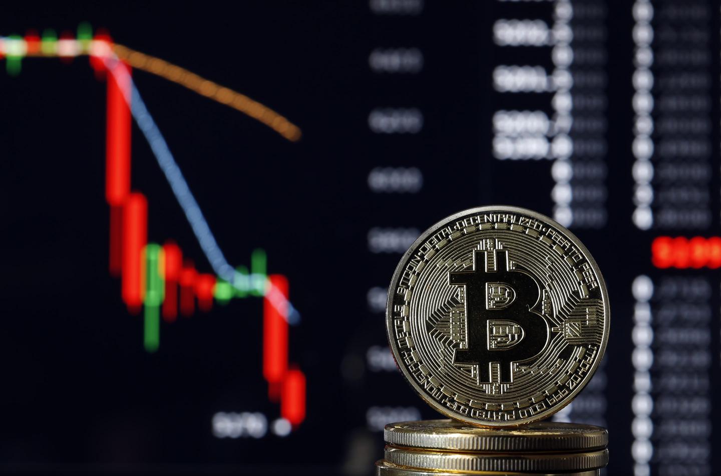 Artistic rendering of a Bitcoin token going down in value