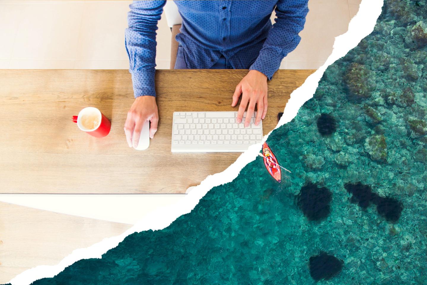 A man sits at a desk with a keyboard and mouse, with a photo of the ocean in a torn paper effect