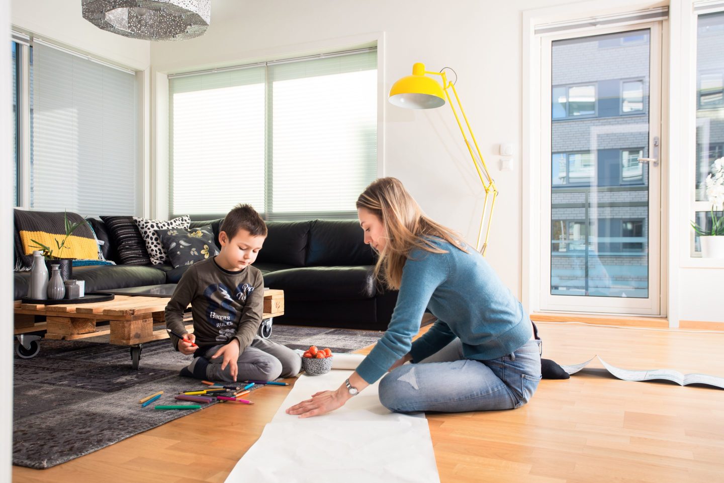 women playing on the floor with young son