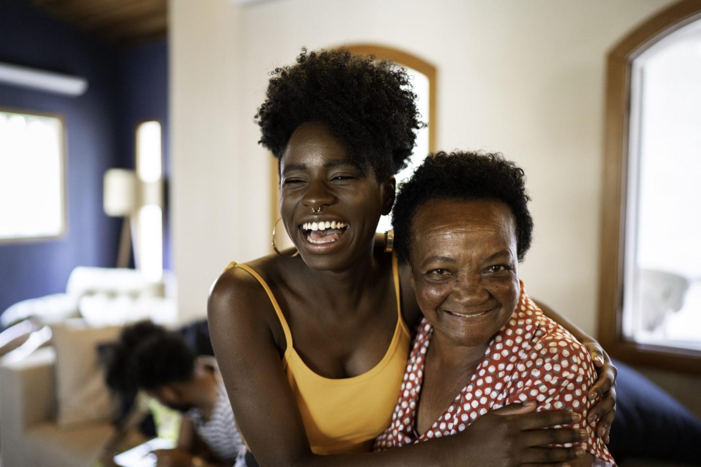 Happy mother and daughter embracing