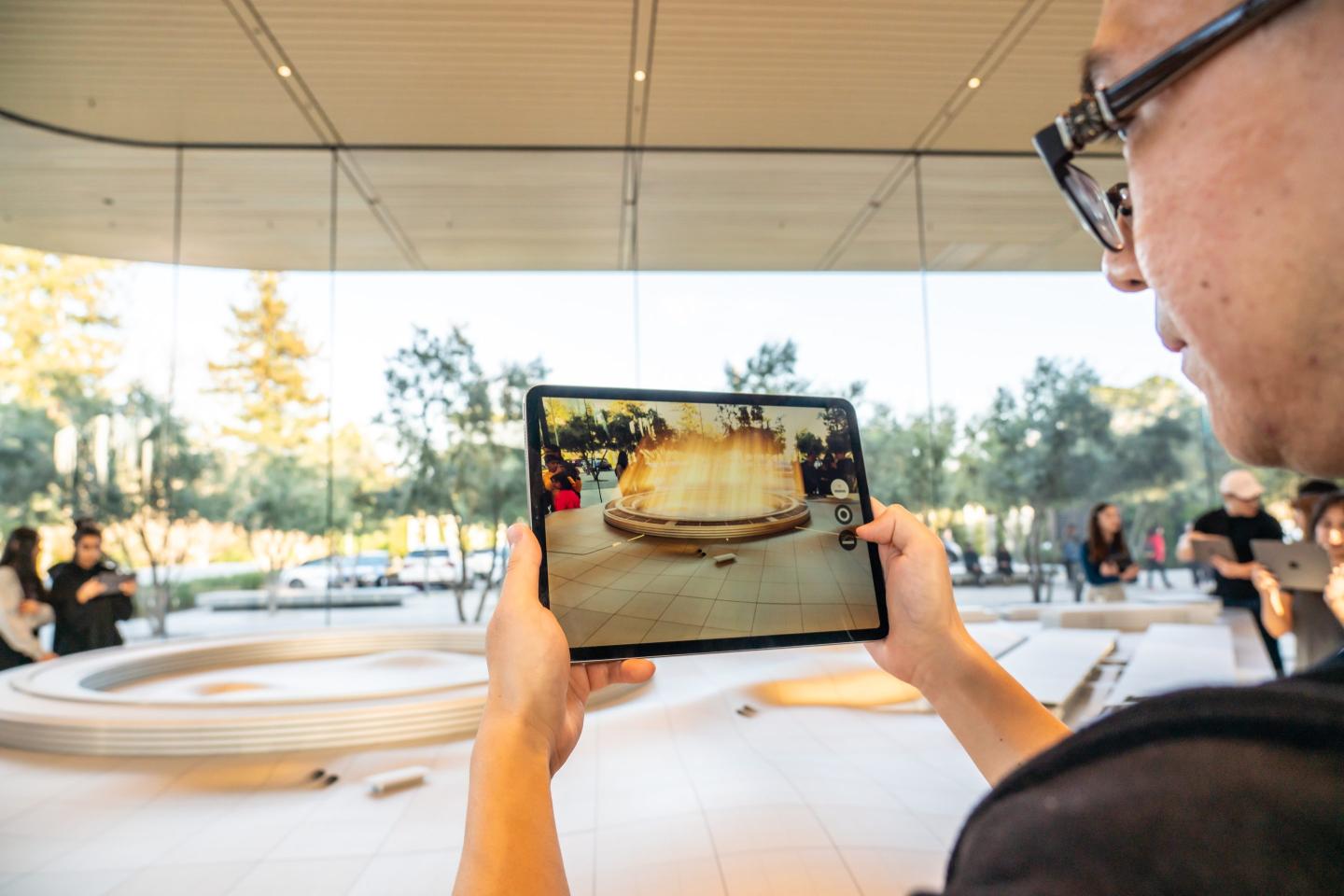 A person using an Apple iPad