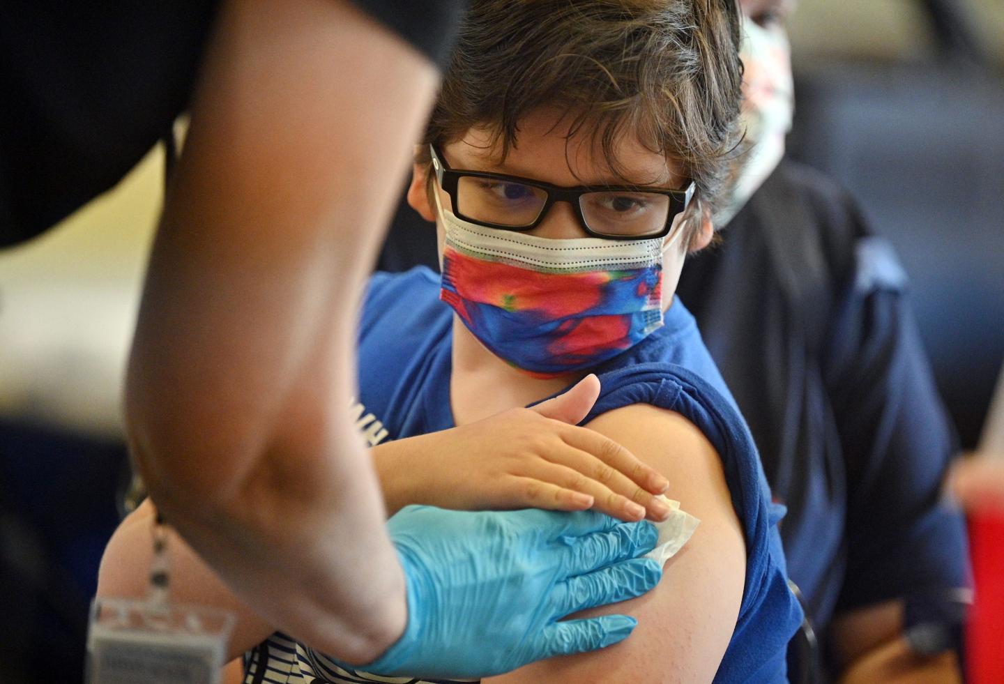 Boy receives COVID-19 vaccine