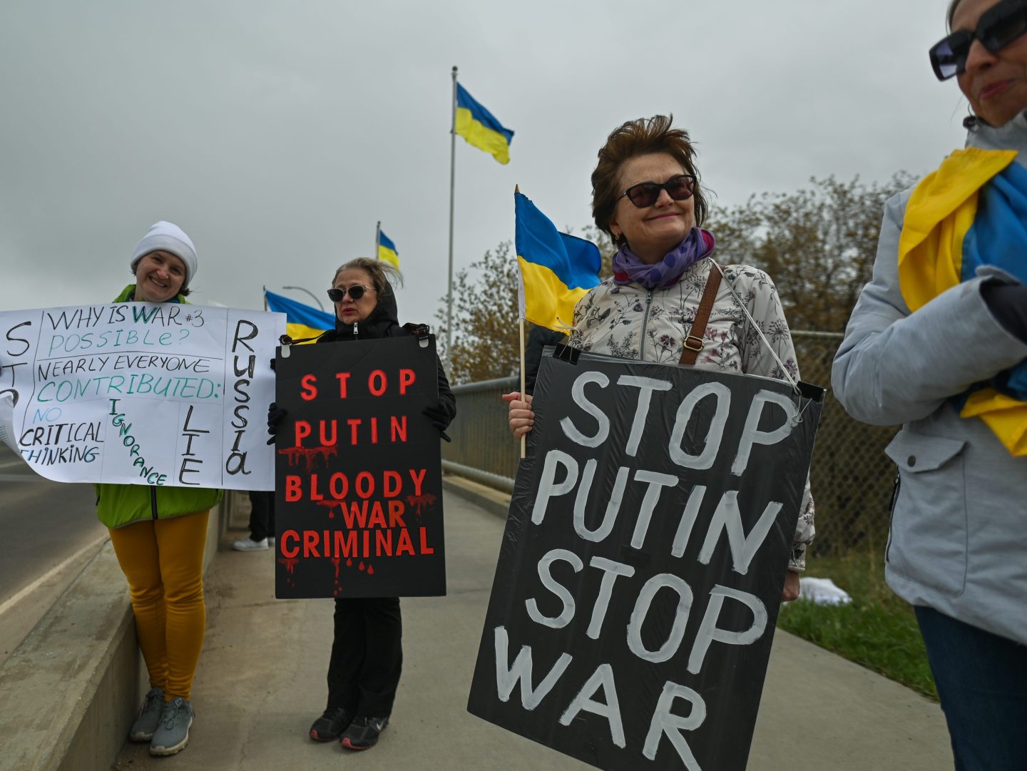 Hundreds of local Ukrainian diaspora members, activists and supporters took part this afternoon in the human chain and 'Walk For Ukraine' rally on White Avenue, in the center of Edmonton.
