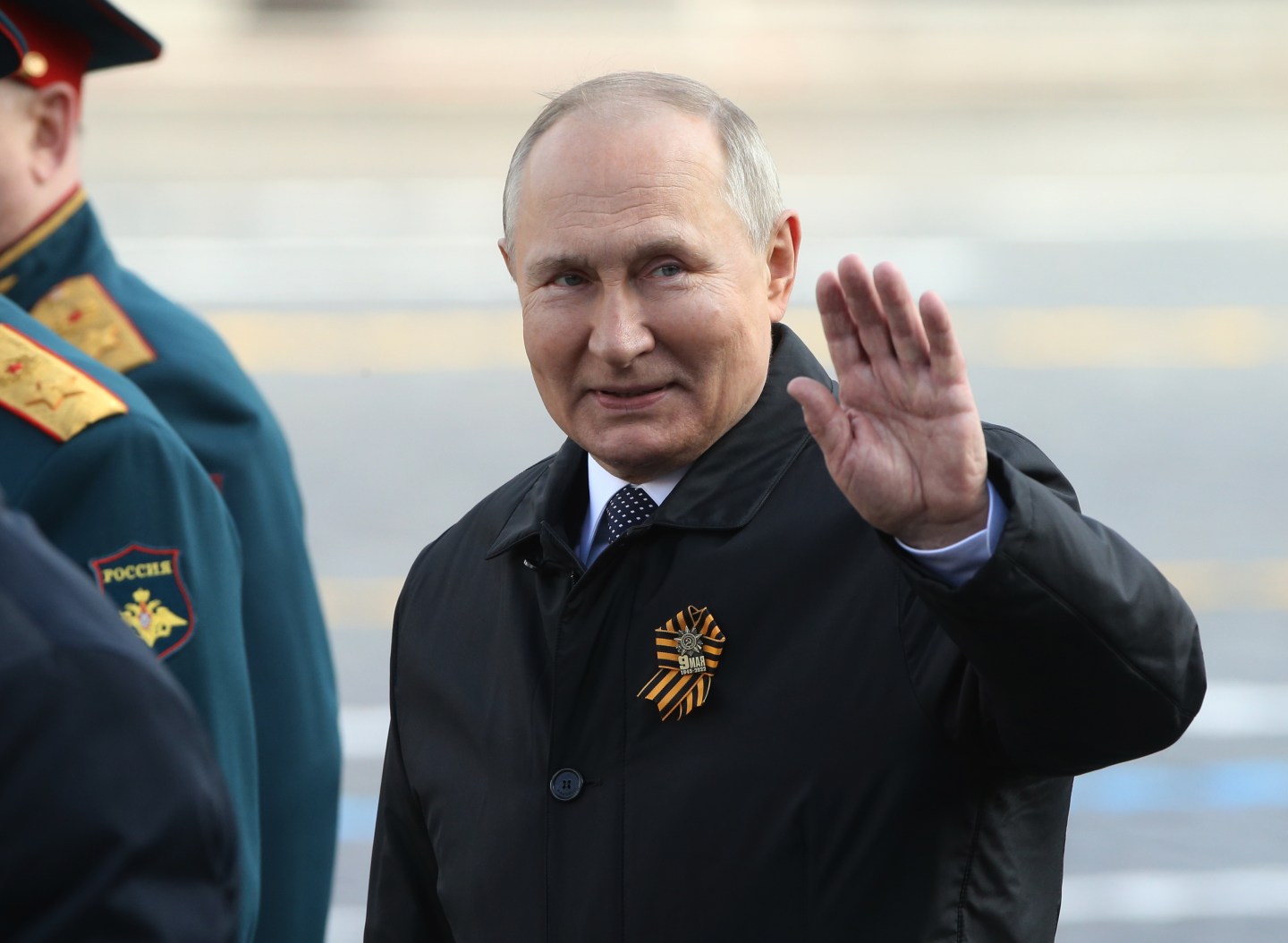 Russian President Vladimir Putin waves during the Victory Day Parade at Red Square on May 9, 2022 in Moscow, Russia.