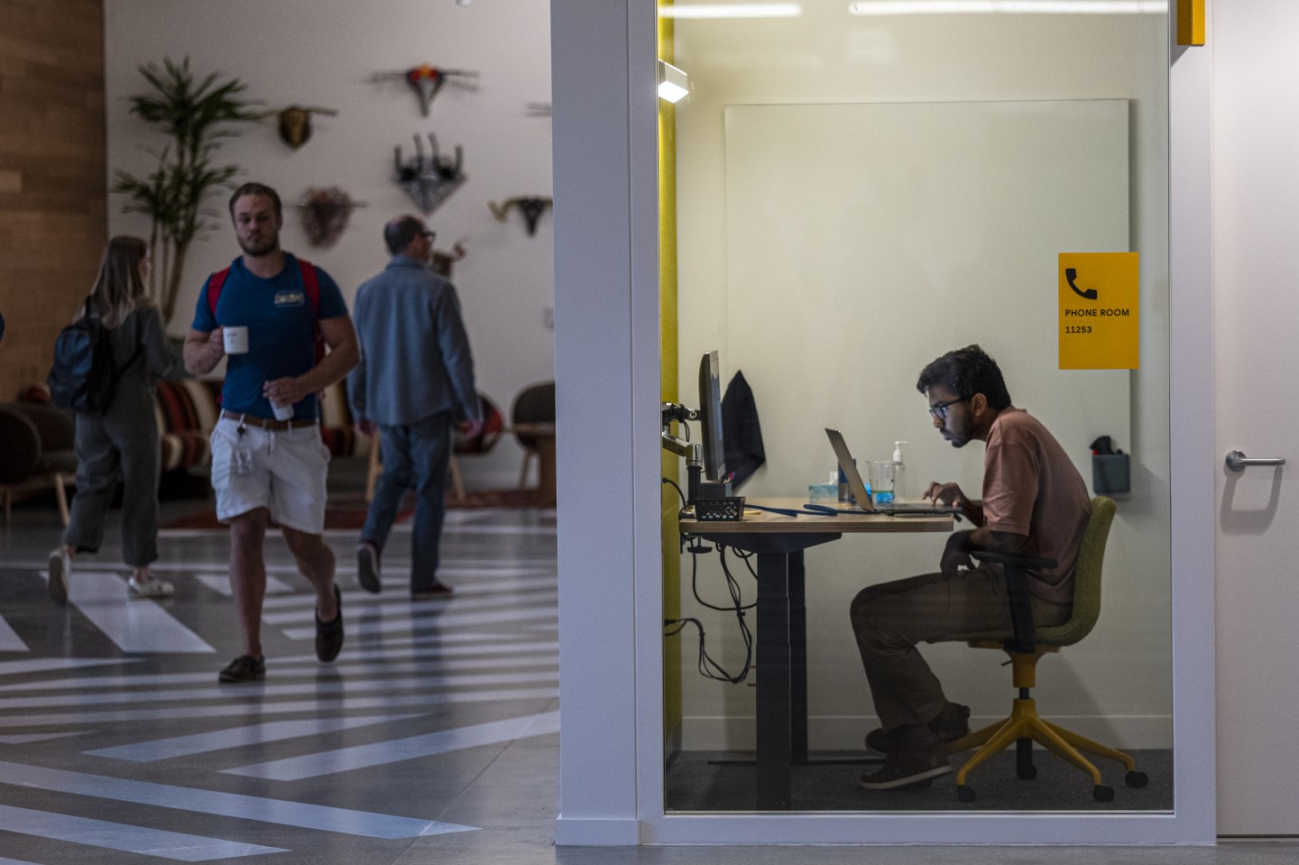 Workers inside Google's new Bay View campus in Mountain View, Calif.