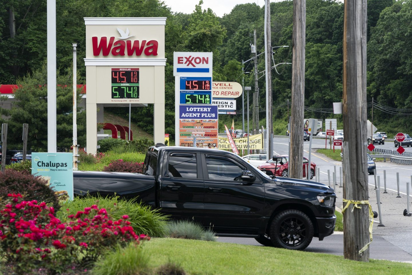 Fuel prices displayed at Wawa and Exxon gas stations