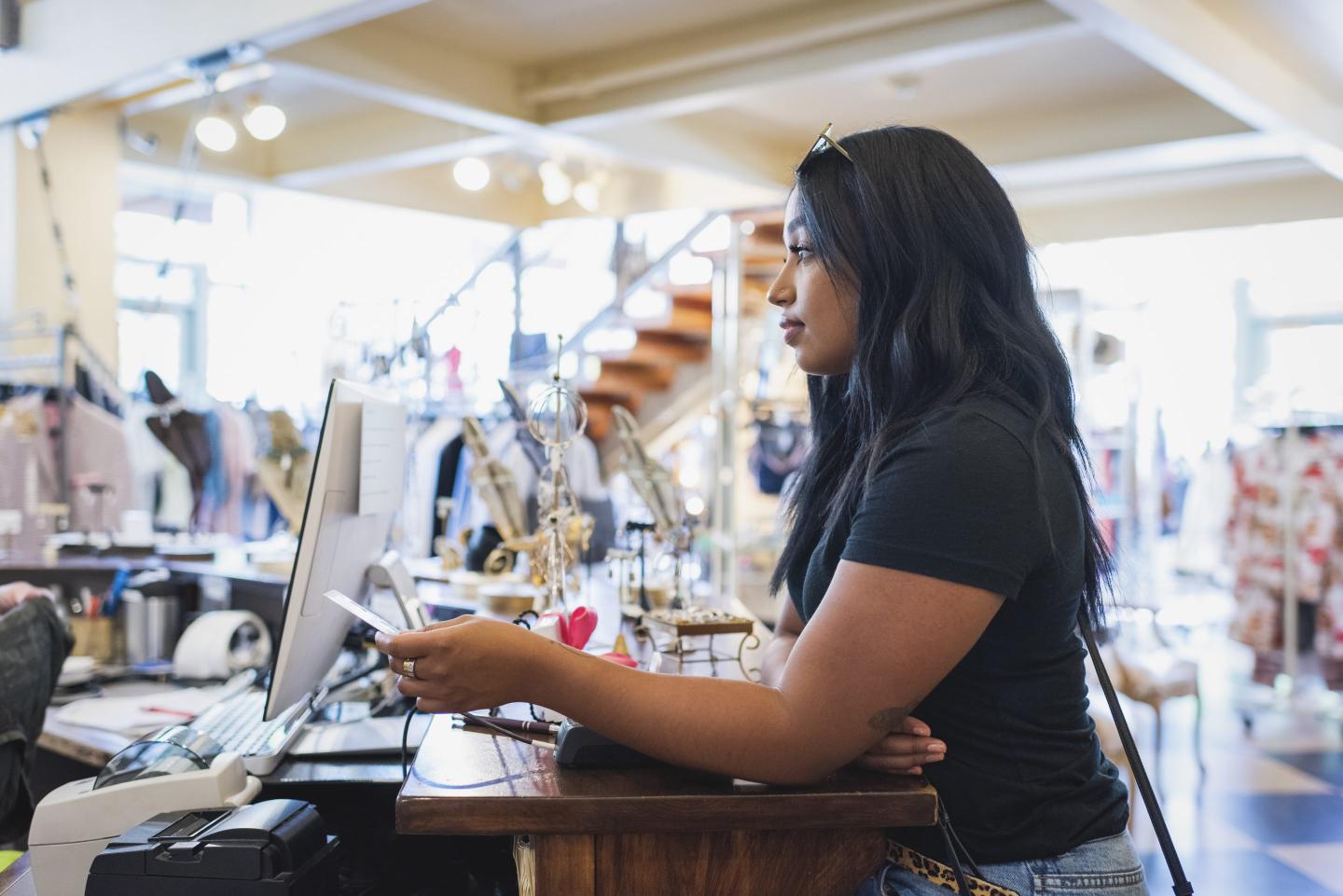 woman paying for a purchase with a debit card