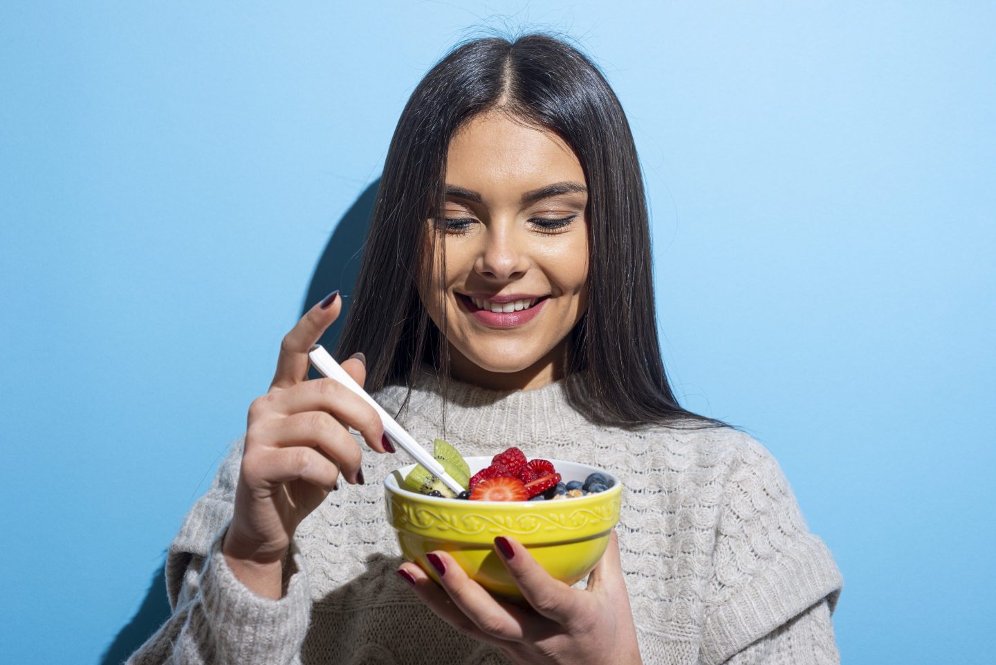 woman eating muesli breakfast