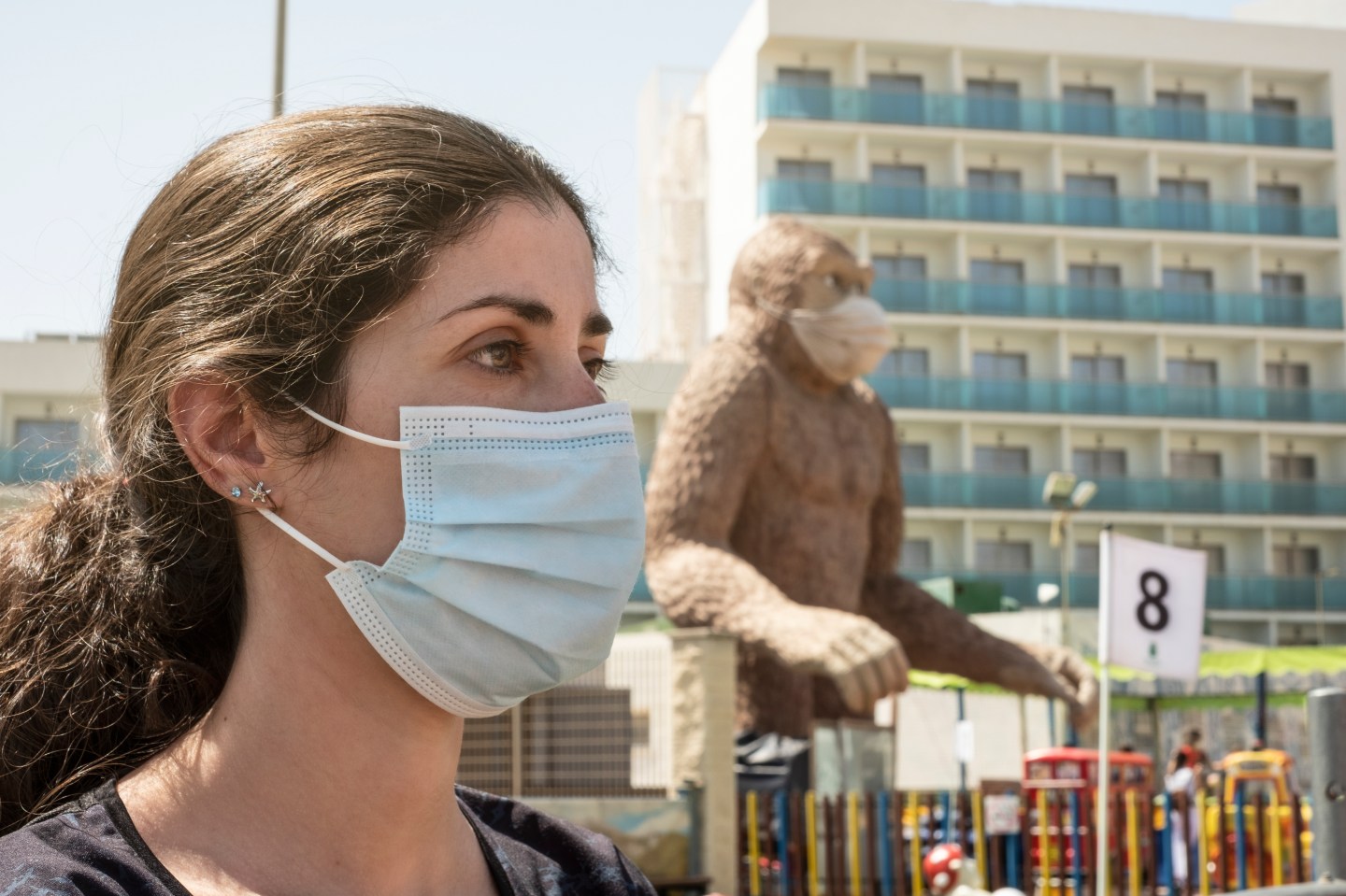 Woman and monkey statue in masks