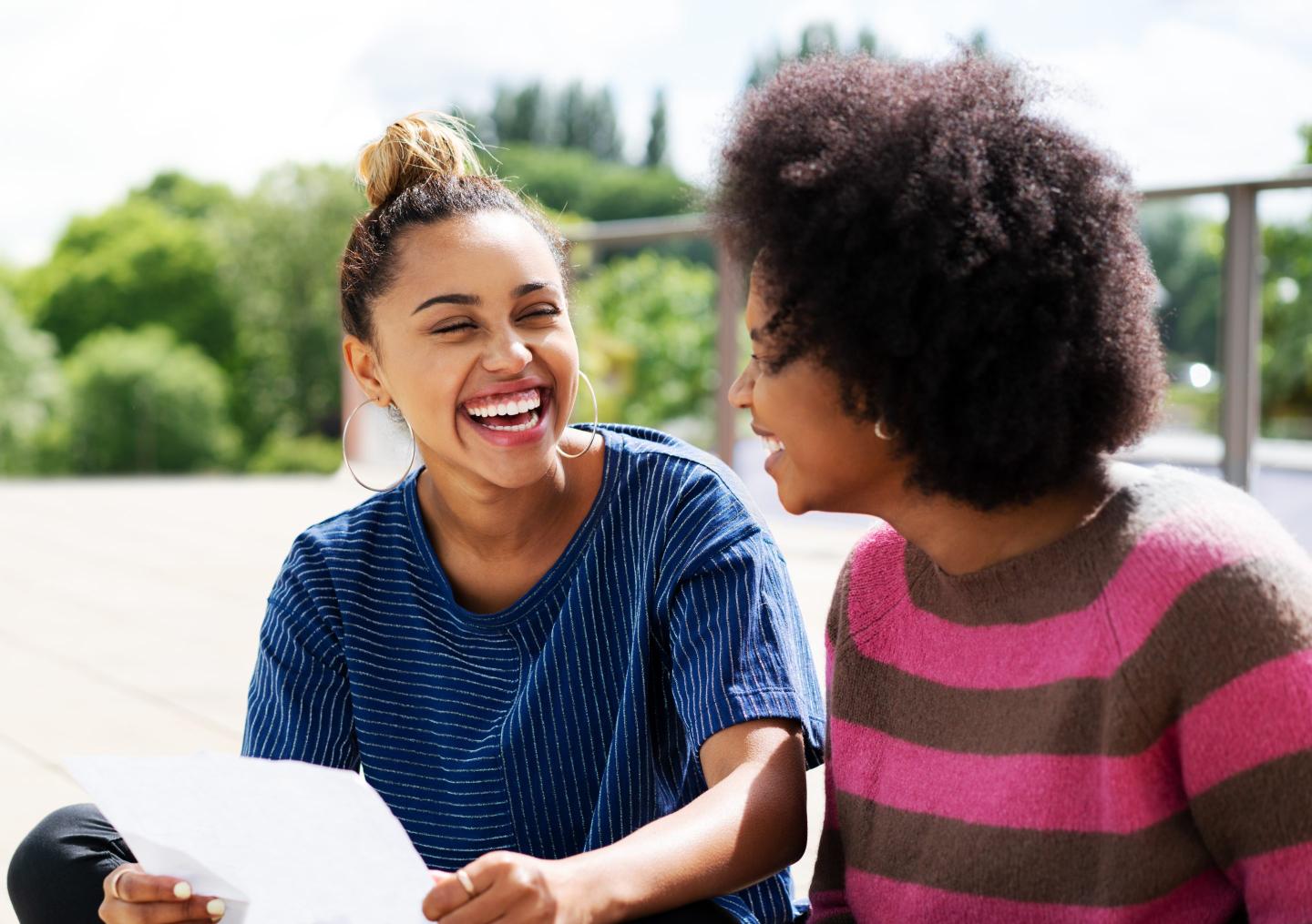 Two women talking and laughing