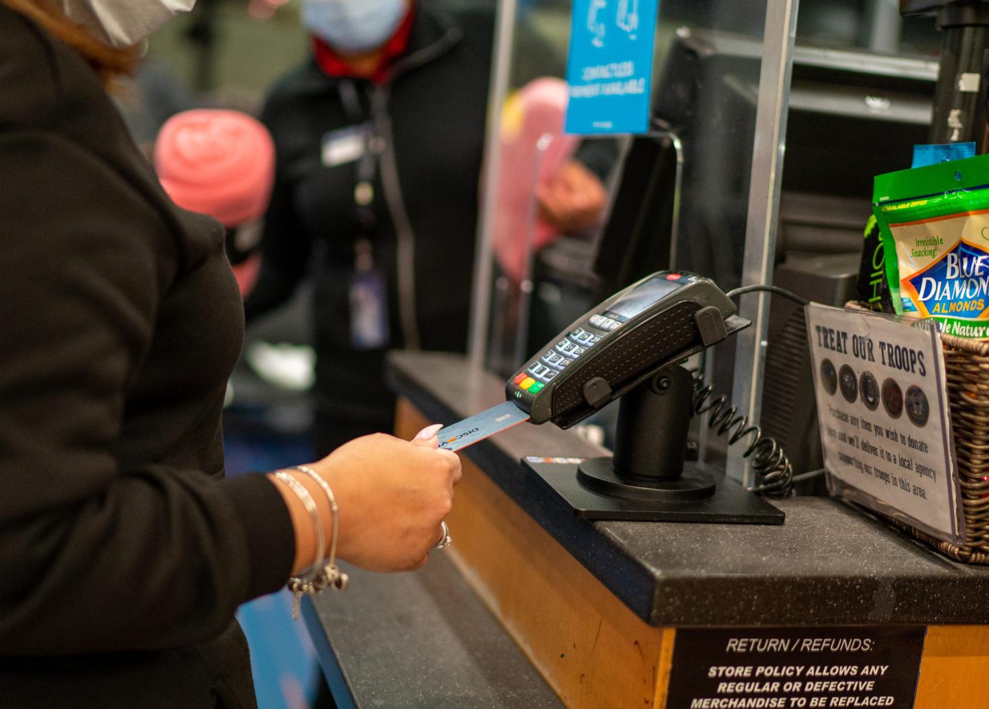 Woman paying for purchase with a credit card