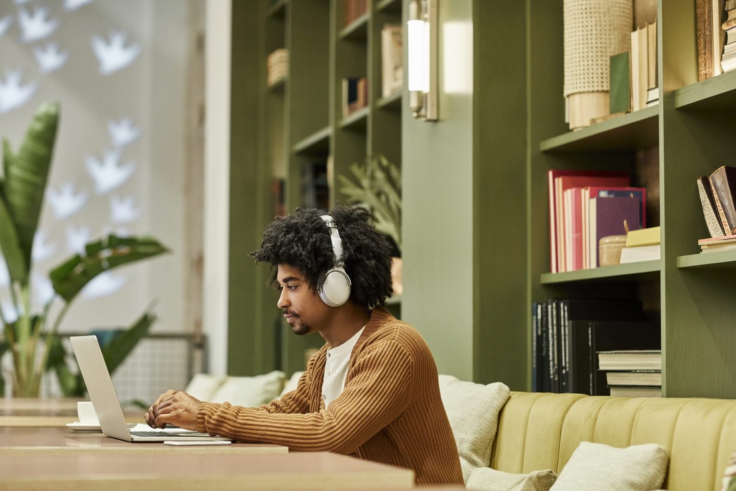 black worker on laptop